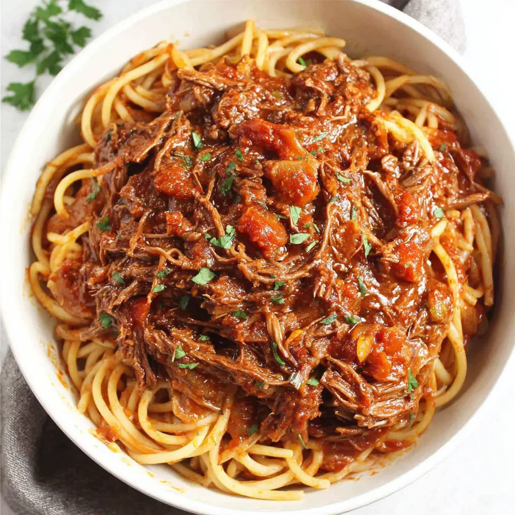 Slow Cooker Beef Ragu - Sunday Dinner Easy Sunday Slow Cooker Beef Ragu simmers beautifully in a slow cooker, showcasing a flavorful and effortless meal perfect for a relaxing weekend.