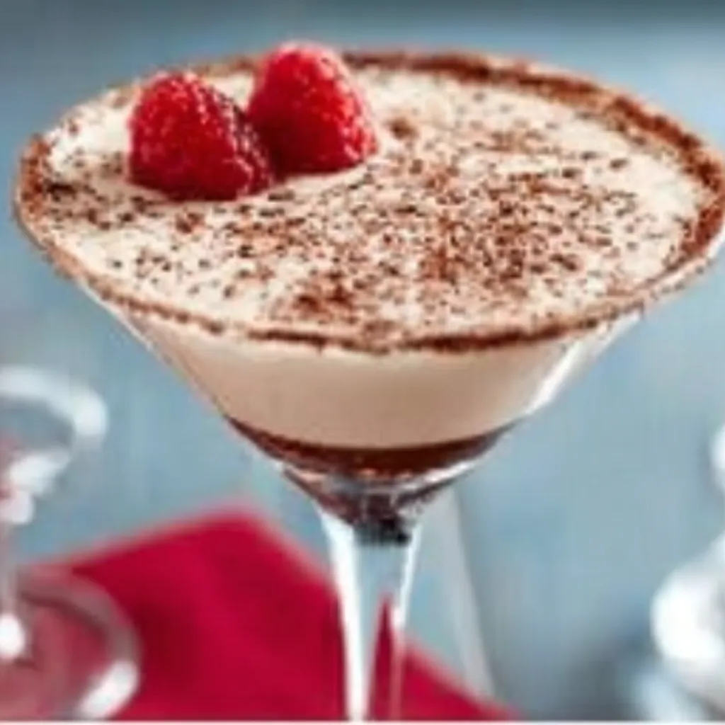A close-up shot showcasing the creamy, decadent texture of a Baileys Chocolate Martini in a stemmed glass.