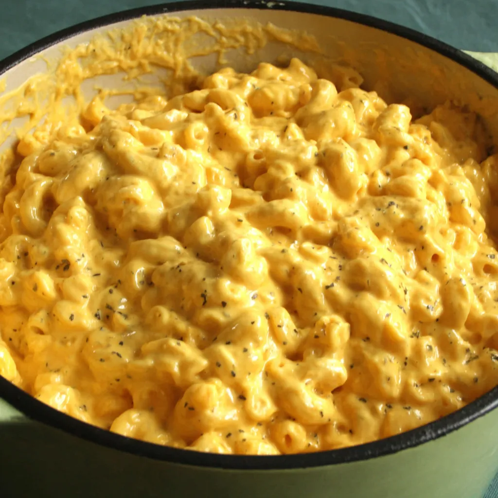 Creamy Mac and Cheese is showcased in this second image highlighting its delicious texture and golden-brown crust.