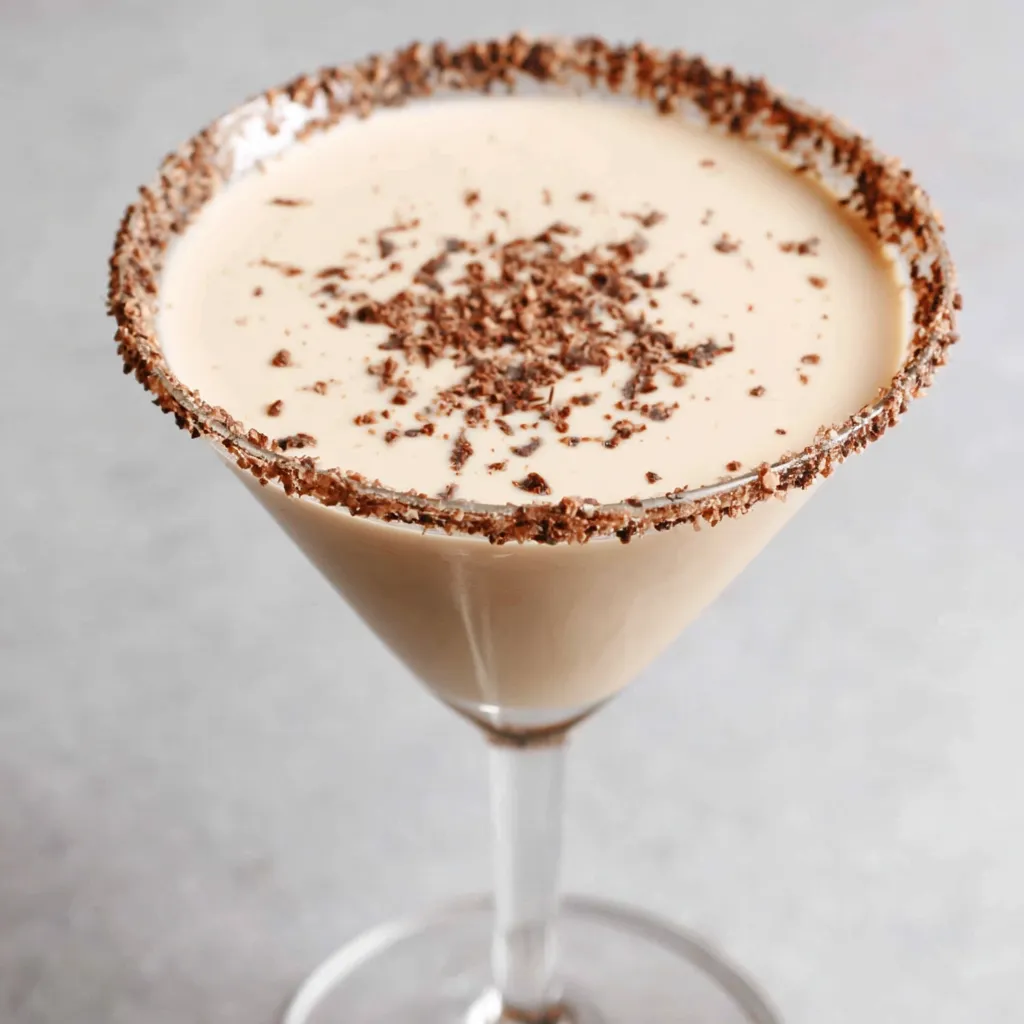 Close-up shot of a creamy and delicious Baileys Irish Martini in a stemmed glass.