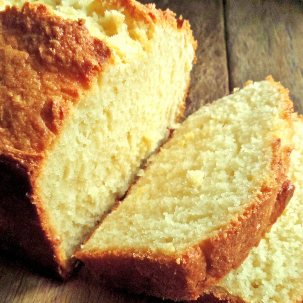 A close-up of freshly baked Christmas Eggnog Bread shows its soft texture and festive spices.