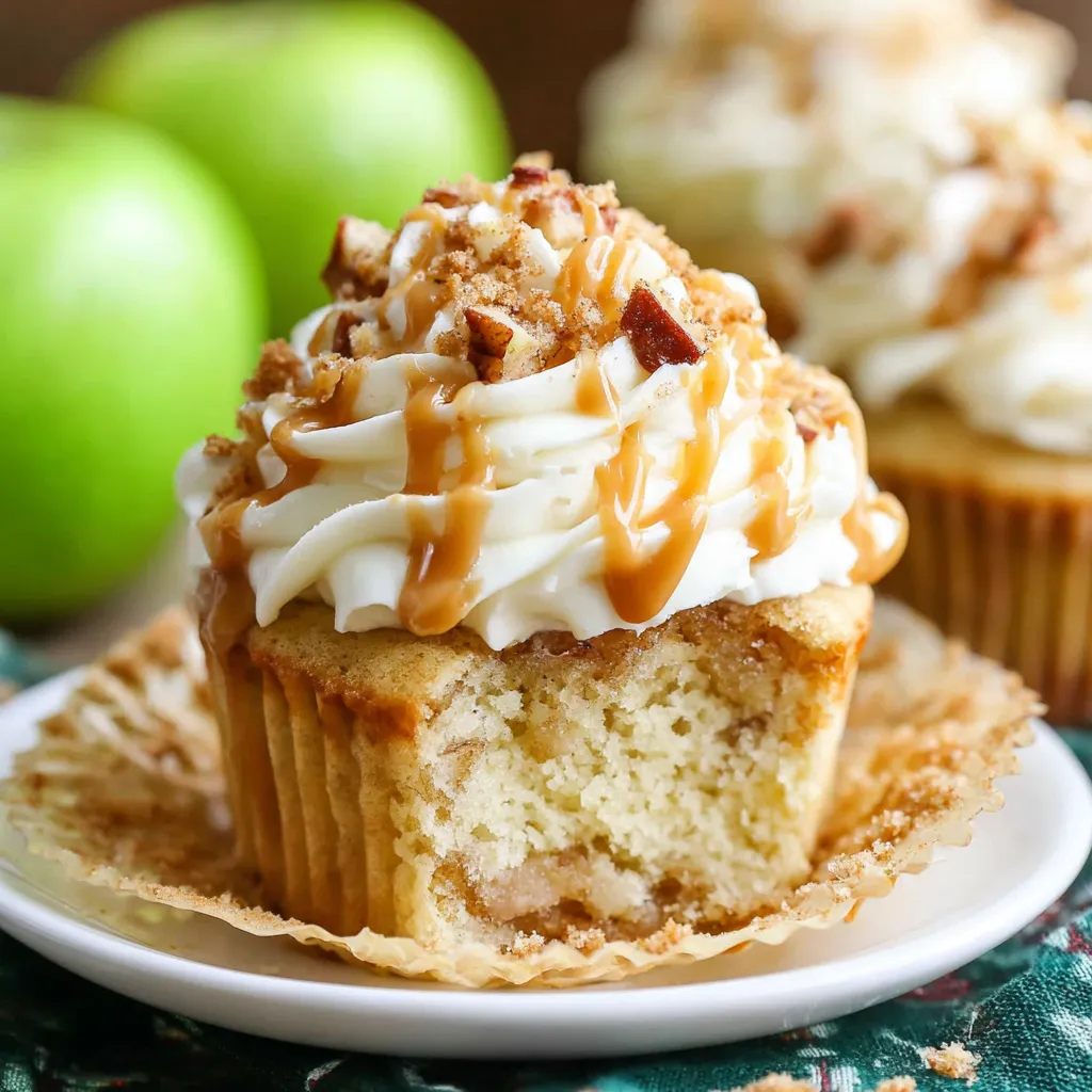 Decadent caramel apple pie cupcakes topped with caramel drizzle and a sprinkle of cinnamon offer a delicious individual dessert option.