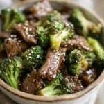 A flavorful plate of Chinese Beef And Broccoli, ready to be enjoyed as a featured meal.