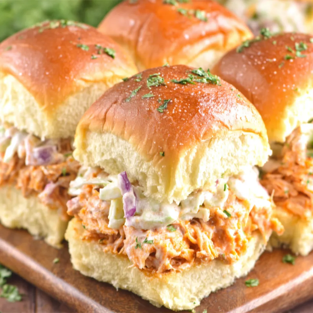 Buffalo Chicken Sliders Closeup Close-up of delicious Buffalo Chicken Sliders, showcasing their juicy chicken and tangy buffalo sauce.