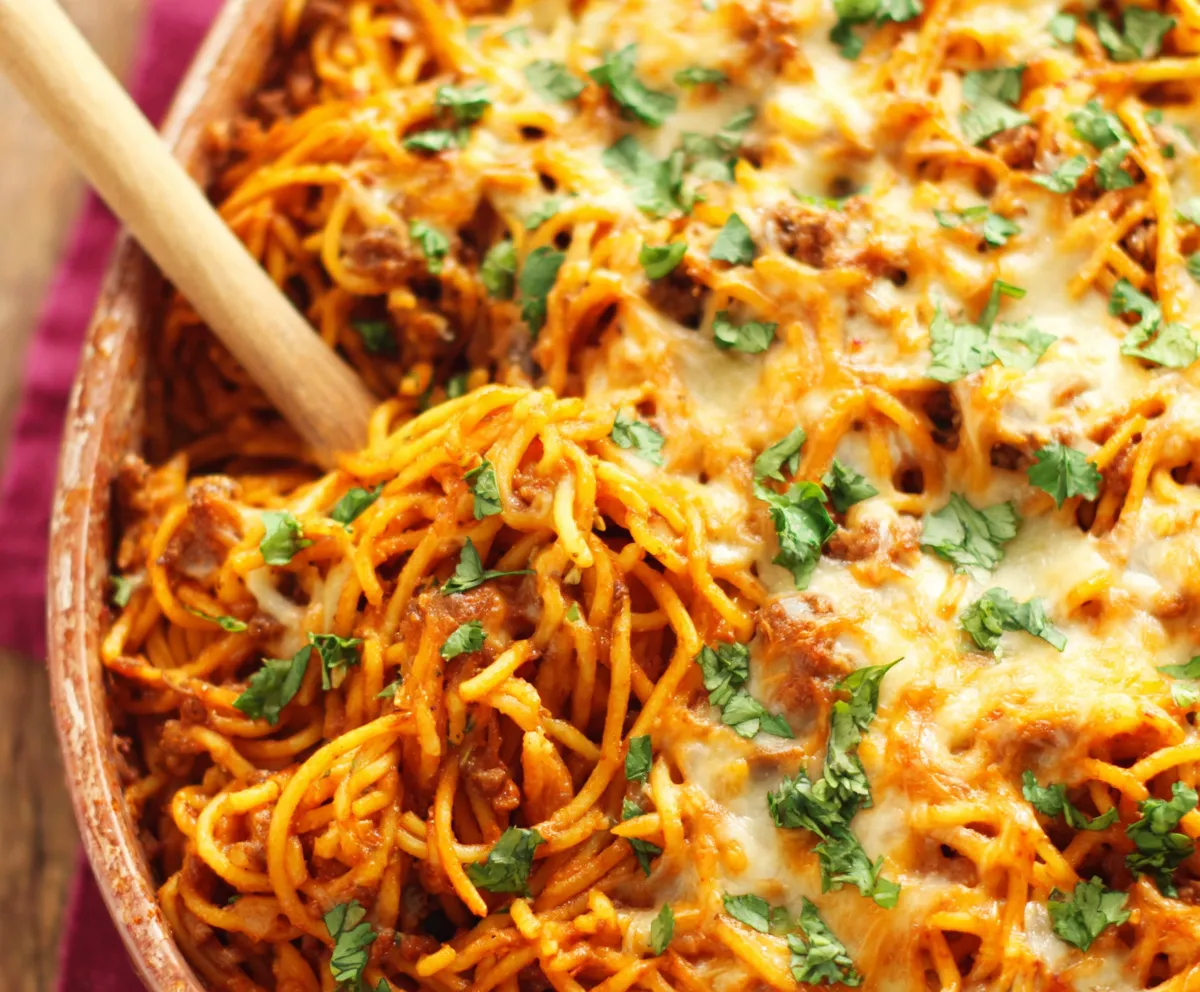 Close-up of a cheesy and bubbly Southern Spaghetti Bake, ready to be served.