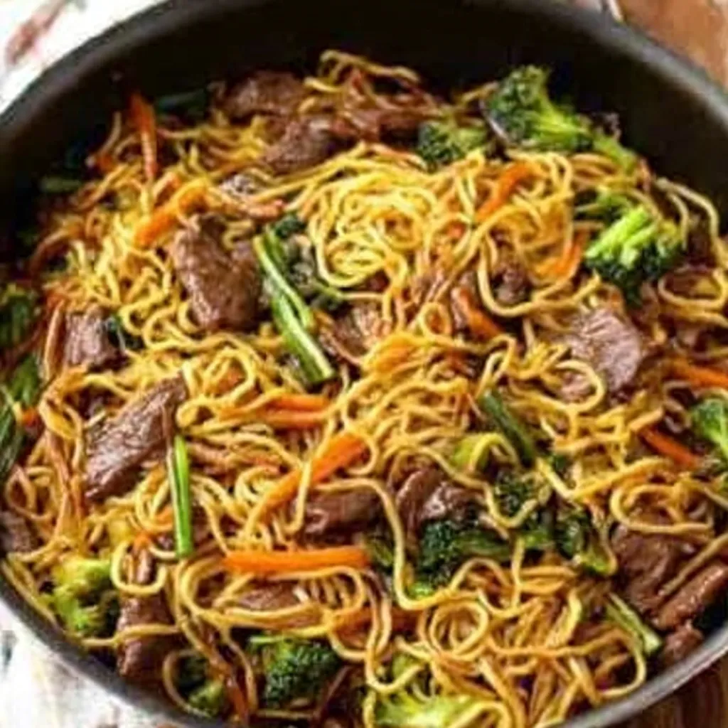 A close-up shot showcasing the rich, flavorful sauce coating the tender beef and noodles in this delicious Sticky Beef Noodles recipe.