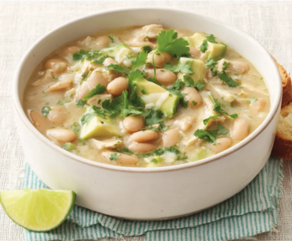 A close-up view of freshly made White Chicken Chili, showcasing its creamy texture and visible ingredients.