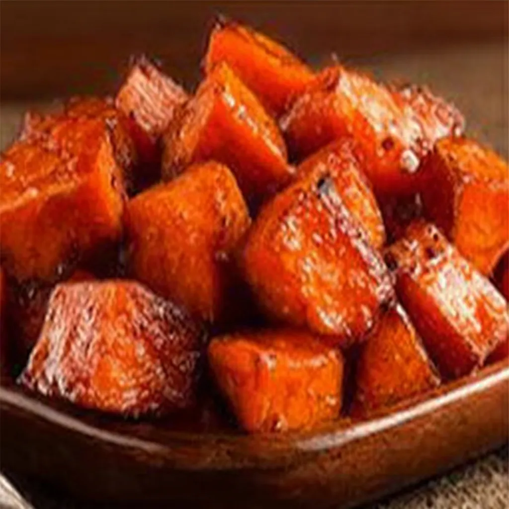 Honey Cinnamon Roasted Sweet Potatoes Close-up of delicious Cinnamon Honey Roasted Sweet Potatoes, showcasing their golden-brown color and glistening honey glaze.