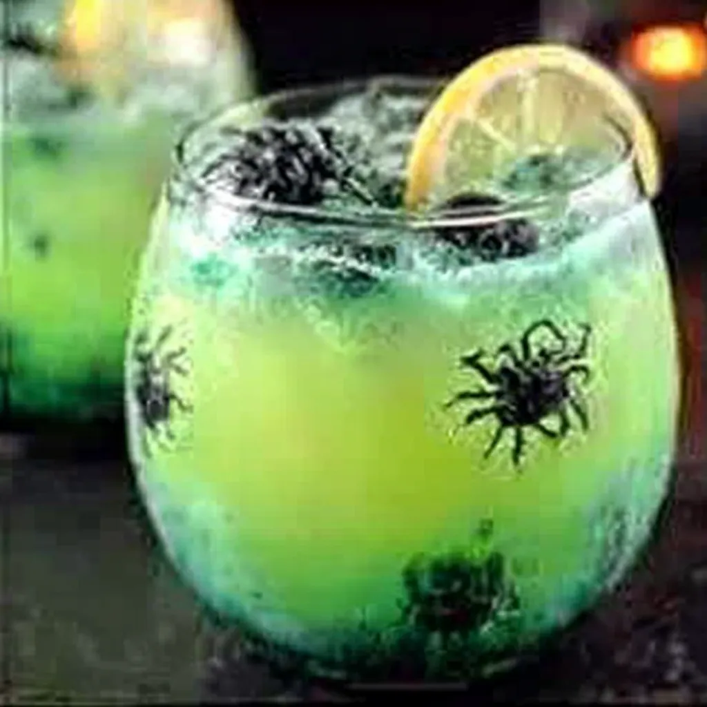 A bubbling cauldron filled with green liquid illustrates a recipe for Witch’s Potion Punch.
