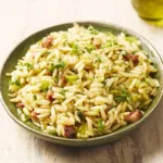 Close-up shot showcasing a bowl of delicious Creamy Orzo, highlighting its creamy texture and appetizing appearance.