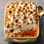 Marshmallow Sweet Potato Casserole is a delicious and visually appealing featured image showcasing the creamy texture and golden-brown marshmallow topping.