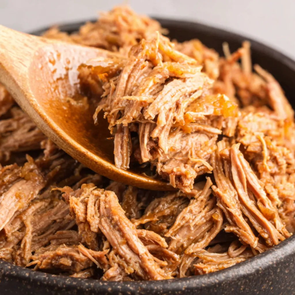 Close-up showcases the delicious Slow Cooker Pulled Beef Onion Gravy, perfect for a comforting meal.