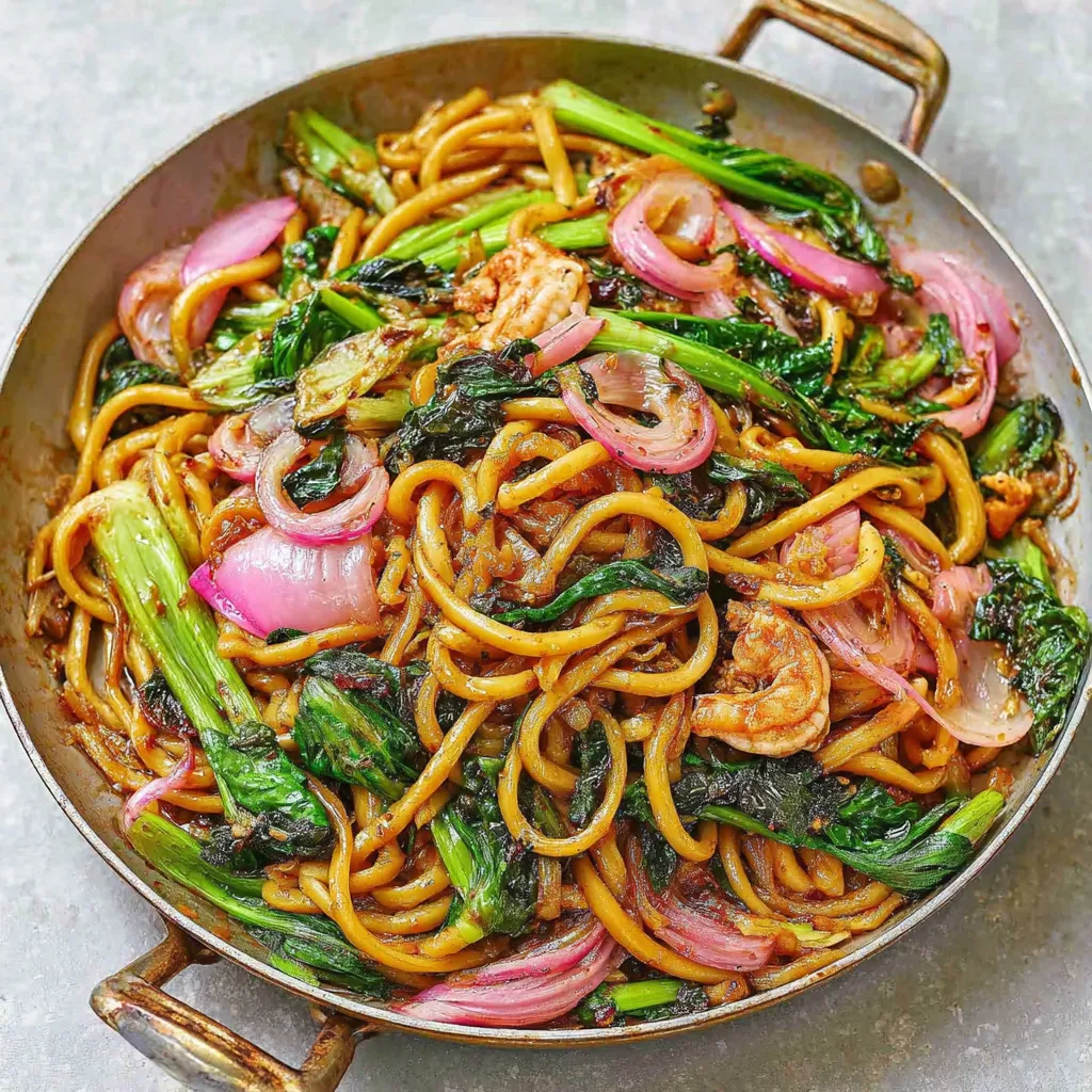 Close-up shot showcasing the savory stir-fried noodles of Yaki Udon, ready to be enjoyed.