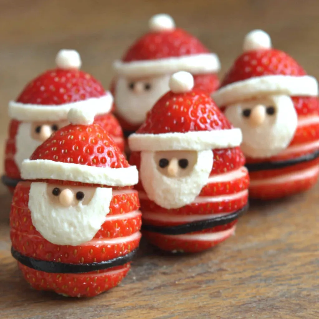 A close-up view shows a batch of freshly made Strawberry Santa Treats, perfect for a festive holiday snack.
