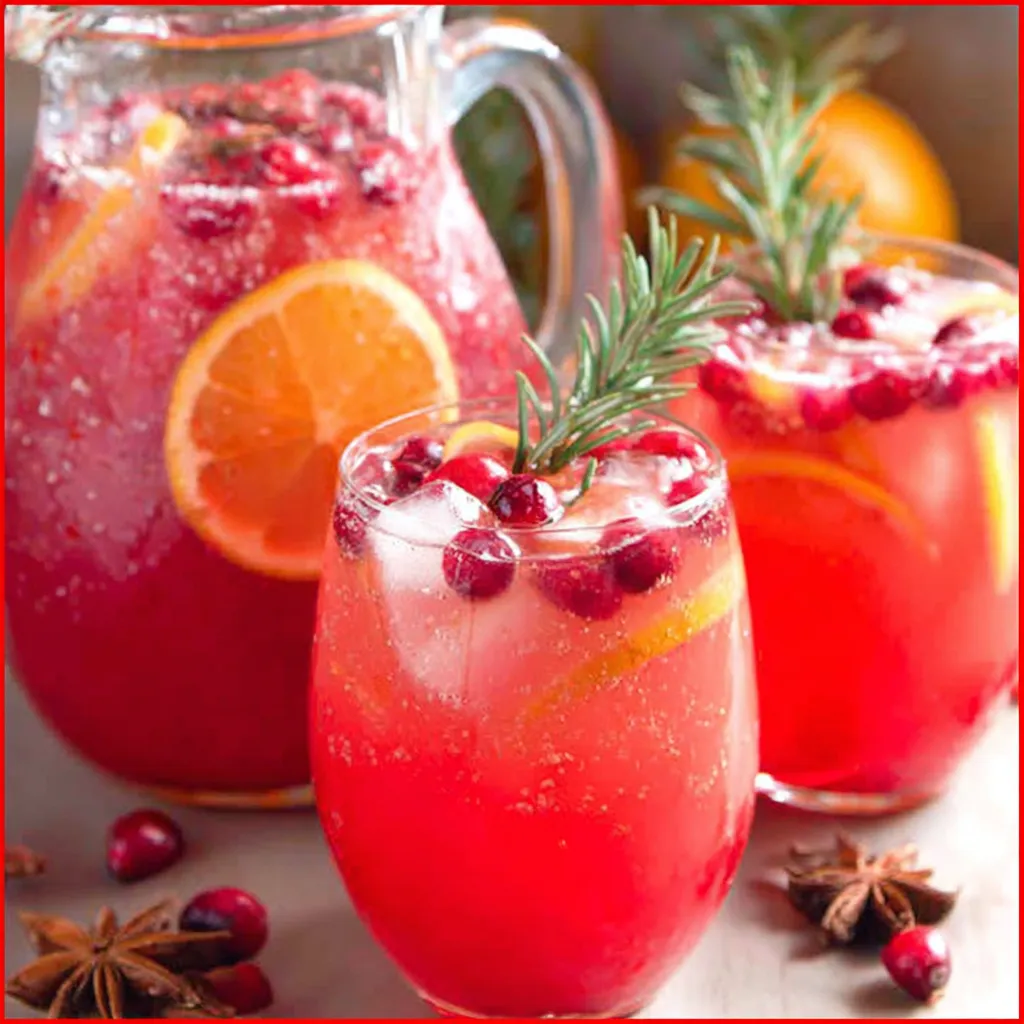 Festive Non Alcoholic Christmas Punch is displayed in a clear punch bowl, ready to be served at a holiday gathering.