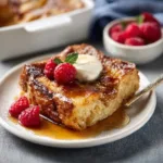 Crème Brûlée French Toast Casserole featured image showcases a golden-brown baked breakfast casserole with a caramelized sugar crust.