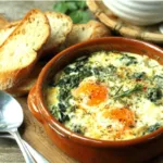 A delicious serving of Baked Eggs Florentine is presented as a featured image, showcasing its creamy spinach and perfectly cooked eggs.