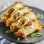 Close-up of delicious Keto Philly Cheesesteak Roll Ups, showcasing the melted cheese and savory filling.